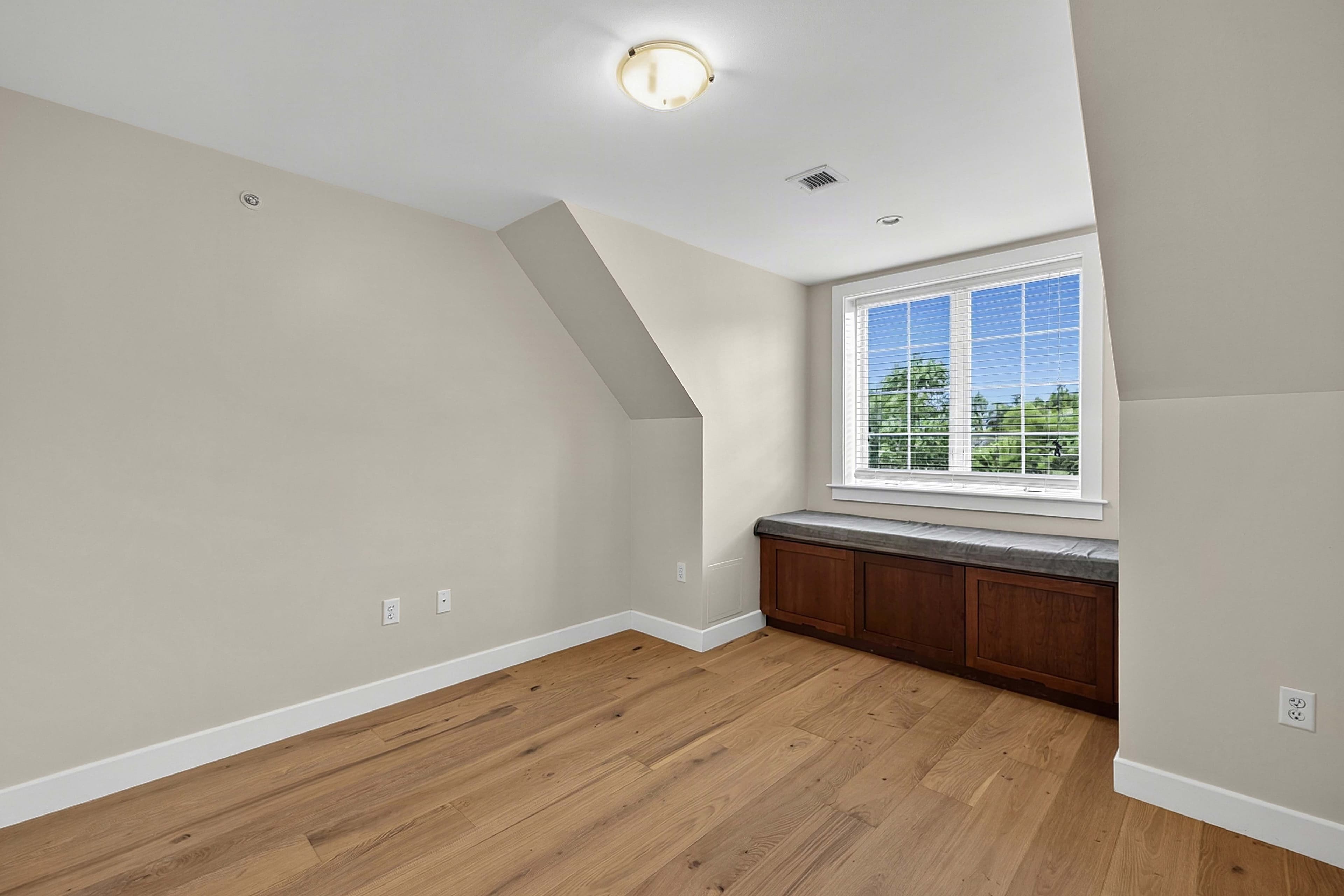 Loft bedroom with a built-in window seat